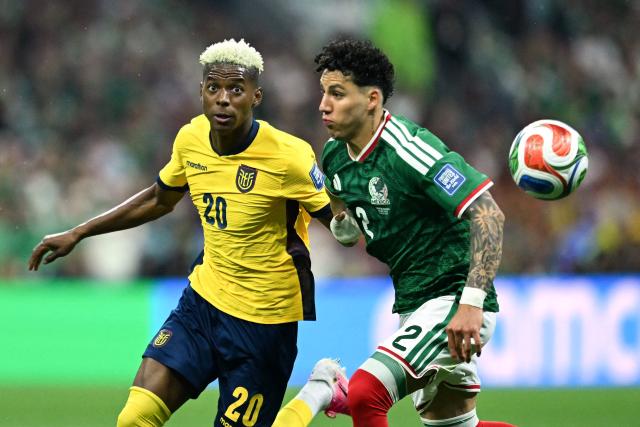 Ecuador's forward #20 Nilson Angulo and Mexico's defender #02 Jorge Sanchez fight for the ball during the 2026 World Cup round of 32 football match between Mexico and Ecuador at the Mexico City Stadium in Mexico City on June 30, 2026.  (Photo by CARL DE SOUZA / AFP)