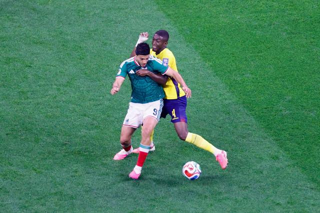 Mexico's forward #09 Raul Jimenez and Ecuador's defender #04 Joel Ordonez fight for the ball during the 2026 World Cup round of 32 football match between Mexico and Ecuador at the Mexico City Stadium in Mexico City on June 30, 2026.  (Photo by Rodrigo Oropeza / AFP)