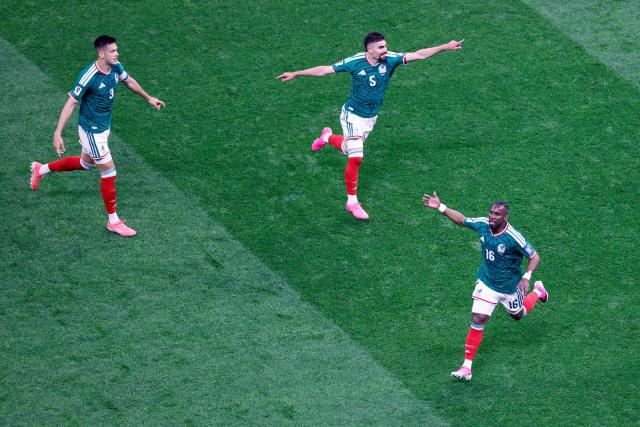 Mexico's forward #16 Julian Quinones celebrates next to teammates defender #03 Cesar Montes and defender #05 Johan Vasquez scoring his team's first goal during the 2026 World Cup round of 32 football match between Mexico and Ecuador at the Mexico City Stadium in Mexico City on June 30, 2026.  (Photo by Rodrigo Oropeza / AFP)