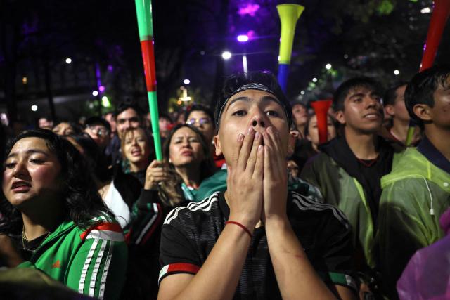Mexican fans react as they watch the FIFA World Cup round of 32 football match between Mexico and Ecuado at the Angel of Independence in Mexico City on June 30, 2026. (Photo by Claudia Rosel / AFP)