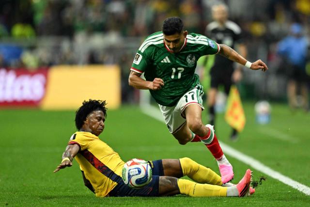 Ecuador's defender #17 Angelo Preciado and Mexico's midfielder #17 Orbelin Pineda fight for the ball during the 2026 World Cup round of 32 football match between Mexico and Ecuador at the Mexico City Stadium in Mexico City on June 30, 2026.  (Photo by CARL DE SOUZA / AFP)