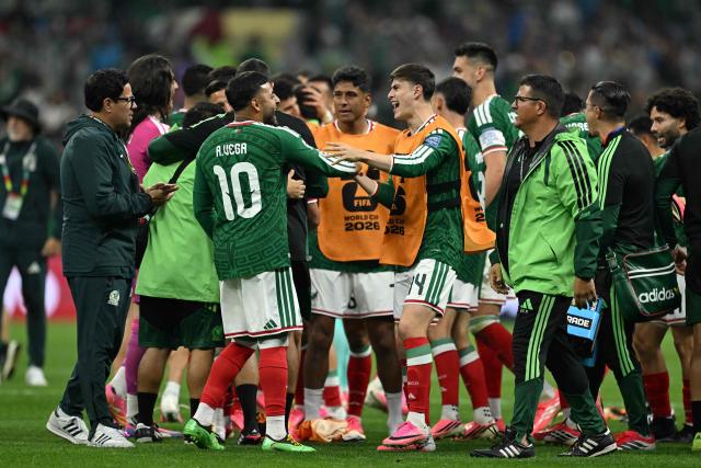 Mexico's forward #10 Alexis Vega and Mexico's forward #14 Armando Gonzalez celebrate after winning the 2026 World Cup round of 32 football match between Mexico and Ecuador at the Mexico City Stadium in Mexico City on June 30, 2026.  (Photo by CARL DE SOUZA / AFP)
