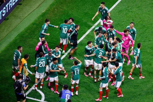 Mexico's players celebrate after winning the 2026 World Cup round of 32 football match between Mexico and Ecuador at the Mexico City Stadium in Mexico City on June 30, 2026.  (Photo by Rodrigo Oropeza / AFP)