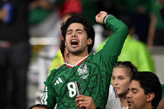 A Mexican fan celebrates at the end of the 2026 World Cup round of 32 football match between Mexico and Ecuador at the Mexico City Stadium in Mexico City on June 30, 2026.  (Photo by CARL DE SOUZA / AFP)
