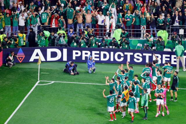 Mexico's players celebrate after winning the 2026 World Cup round of 32 football match between Mexico and Ecuador at the Mexico City Stadium in Mexico City on June 30, 2026.  (Photo by Rodrigo Oropeza / AFP)