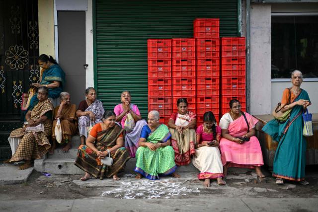 Hindu devotees waiting to take part in a chariot festival of Sri Parthasarathy Temple in Chennai on July 1, 2026. (Photo by R. Satish BABU / AFP)