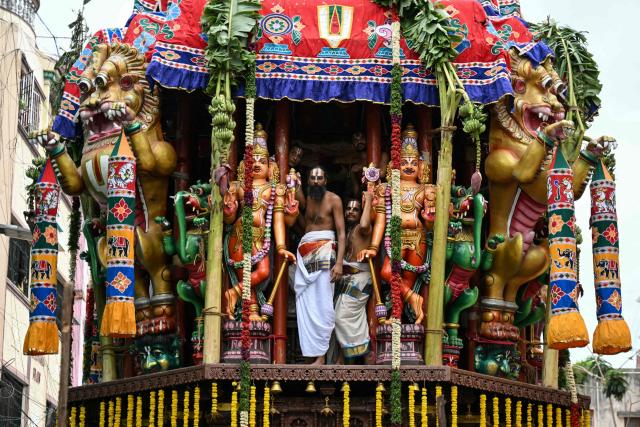 Priests take part in a religious procession to mark the Hindu chariot festival of Sri Parthasarathy Temple in Chennai on July 1, 2026. (Photo by R. Satish BABU / AFP)
