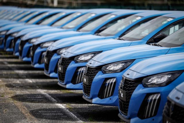 (FILES) Peugeot cars are seen parked outside the  Stellantis multinational car manufacturer's plant in Poissy, west of Paris, on April 15, 2026. New car sales jumped 11.4% year-on-year in June, in a market that still has not returned to its pre-Covid-19 pandemic level, according to preliminary data released  on July 1, 2026 by the Automotive Platform (PFA). (Photo by Simon Wohlfahrt / AFP)