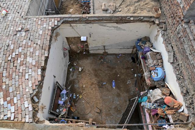 A general view shows the collapsed roof of a tutoring centre a day later in Lahore on July 1, 2026, after it collapsed the previous day. A roof collapse at a tutoring centre in the eastern Pakistani city of Lahore killed at least 14 children and injured five on June 30, officials said. (Photo by Arif ALI / AFP)