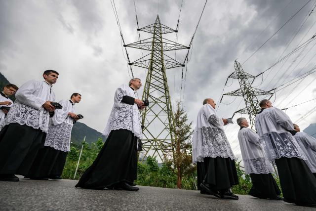 The procession proceeds prior to the schismatic consecration of bishops by the traditionalist Catholic Society of Saint Pius X (SSPX) in Econe, western Switzerland, on July 1, 2026. On June 30, 2026, Pope Leo XIV urged the Society to abandon its plan to ordain bishops without Vatican approval, warning it would lead to automatic excommunication. Founded in 1970 in Econe by French bishop Marcel Lefebvre, the Society of Saint Pius X categorically rejects the changes in the Church since the Second Vatican Council. (Photo by Fabrice COFFRINI / AFP)