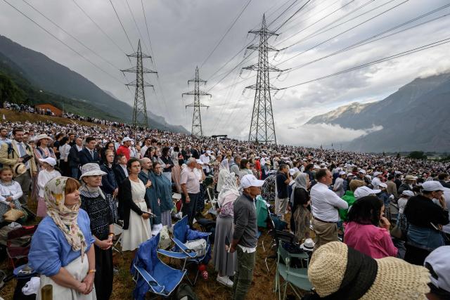 Worshippers attend the schismatic consecration of bishops by the traditionalist Catholic Society of Saint Pius X (SSPX) in Econe, western Switzerland, on July 1, 2026. On June 30, 2026, Pope Leo XIV urged the Society to abandon its plan to ordain bishops without Vatican approval, warning it would lead to automatic excommunication. Founded in 1970 in Econe by French bishop Marcel Lefebvre, the Society of Saint Pius X categorically rejects the changes in the Church since the Second Vatican Council. (Photo by Fabrice COFFRINI / AFP)