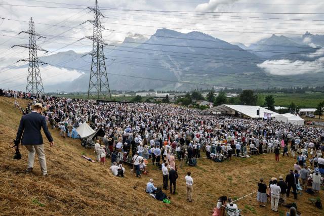 Worshippers attend the schismatic consecration of bishops by the traditionalist Catholic Society of Saint Pius X (SSPX) in Econe, western Switzerland, on July 1, 2026. Defying Vatican, Society of Saint Pius X will ordain its own bishops on July 1, 2026, despite risk of being considered schismatic. (Photo by Fabrice COFFRINI / AFP)