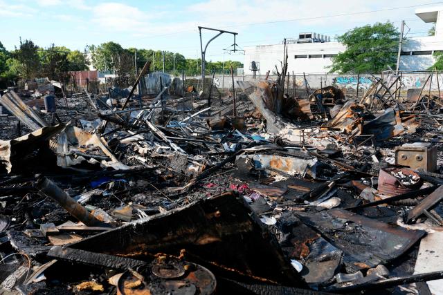 This photograph shows a burnt area after the evacuation and clearance operation of the Stains' shantytown, North of Paris, on July 1, 2026. (Photo by Dimitar DILKOFF / AFP)