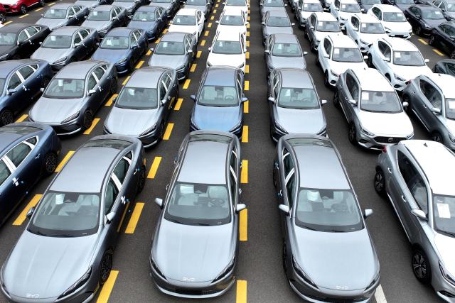 BYD and MG cars, from Chinese automakers, are seen at the Dongfang port branch of Lianyungang Port in Jiangsu province, eastern China on July 1, 2026, ready to be loaded onto ships for export. (Photo by -STR / CN-STR / AFP) / China OUT