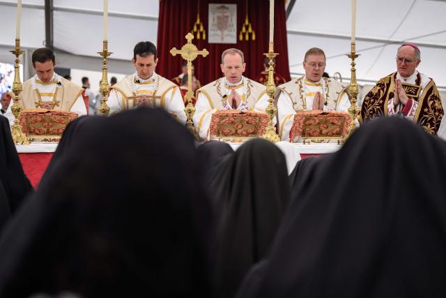 (From L) The new traditionalist Catholic bishops French Marc Hanappier, French Michel Poinsinet de Sivry, US' Michael Goldade and Swiss Pascal Schreiber stand next to Swiss traditionalist Catholic Bishop of the Society of Saint Pius X (SSPX) Bernard Fellay during the schismatic consecration of bishops by the traditionalist Catholic Society of Saint Pius X (SSPX) in Econe, western Switzerland, on July 1, 2026. On June 30, 2026, Pope Leo XIV urged the Society to abandon its plan to ordain bishops without Vatican approval, warning it would lead to automatic excommunication. Founded in 1970 in Econe by French bishop Marcel Lefebvre, the Society of Saint Pius X categorically rejects the changes in the Church since the Second Vatican Council. (Photo by Fabrice COFFRINI / AFP)