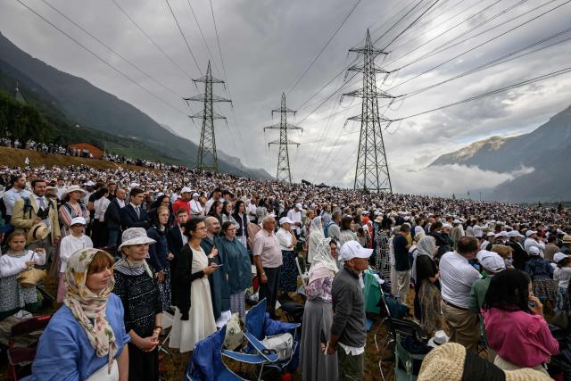 Worshippers attend the schismatic consecration of bishops by the traditionalist Catholic Society of Saint Pius X (SSPX) in Econe, western Switzerland, on July 1, 2026. On June 30, 2026, Pope Leo XIV urged the Society to abandon its plan to ordain bishops without Vatican approval, warning it would lead to automatic excommunication. Founded in 1970 in Econe by French bishop Marcel Lefebvre, the Society of Saint Pius X categorically rejects the changes in the Church since the Second Vatican Council. (Photo by Fabrice COFFRINI / AFP)