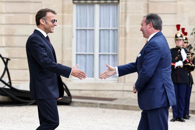 France's President Emmanuel Macron (L) welcomes Luxembourg's Grand Duke Guillaume upon his arrival at the Elysee Presidential Palace in Paris on July 1, 2026. (Photo by SIMON WOHLFAHRT / AFP)