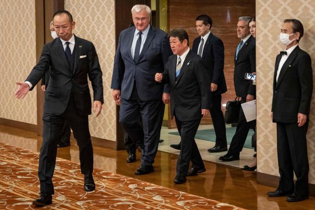 Japan's Foreign Minister Toshimitsu Motegi (center R) and Ukraine's Foreign Affairs Minister Andriy Sybiga (center L) arrive for their meeting at the Iikura Guest House in Tokyo on July 1, 2026. (Photo by Yuichi YAMAZAKI / AFP)