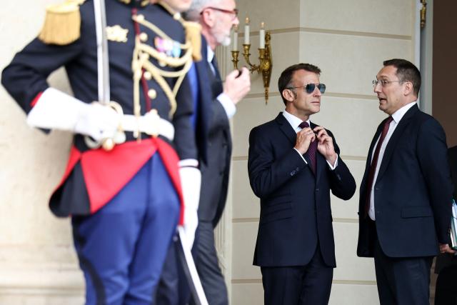 France's President Emmanuel Macron (C) waits to welcome Luxembourg's Grand Duke Guillaume and Luxembourg's Grand Duchess Stephanie at the Elysee Presidential Palace in Paris on July 1, 2026. (Photo by SIMON WOHLFAHRT / AFP)