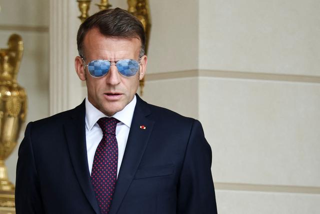 France's President Emmanuel Macron waits to welcome Luxembourg's Grand Duke Guillaume and Luxembourg's Grand Duchess Stephanie at the Elysee Presidential Palace in Paris on July 1, 2026. (Photo by SIMON WOHLFAHRT / AFP)