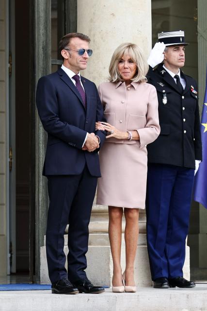 France's President Emmanuel Macron and his wife Brigitte Macron wait to welcome Luxembourg's Grand Duke Guillaume and Luxembourg's Grand Duchess Stephanie at the Elysee Presidential Palace in Paris on July 1, 2026. (Photo by SIMON WOHLFAHRT / AFP)