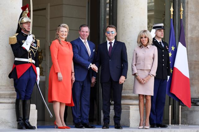 (From L) Luxembourg's Grand Duchess Stephanie, Luxembourg's Grand Duke Guillaume, France's President Emmanuel Macron and his wife Brigitte Macron react as they leave after a meeting at the Elysee Presidential Palace in Paris on July 1, 2026. (Photo by SIMON WOHLFAHRT / AFP)