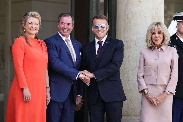 (From L) Luxembourg's Grand Duchess Stephanie, Luxembourg's Grand Duke Guillaume, France's President Emmanuel Macron and his wife Brigitte Macron react as they leave after a meeting at the Elysee Presidential Palace in Paris on July 1, 2026. (Photo by SIMON WOHLFAHRT / AFP)
