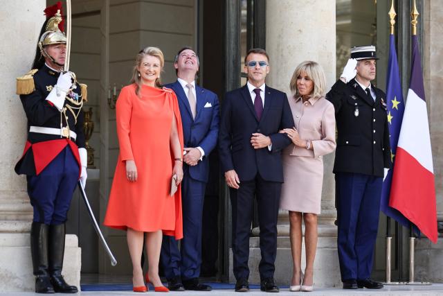 (From L) Luxembourg's Grand Duchess Stephanie, Luxembourg's Grand Duke Guillaume, France's President Emmanuel Macron and his wife Brigitte Macron react as they leave after a meeting at the Elysee Presidential Palace in Paris on July 1, 2026. (Photo by SIMON WOHLFAHRT / AFP)