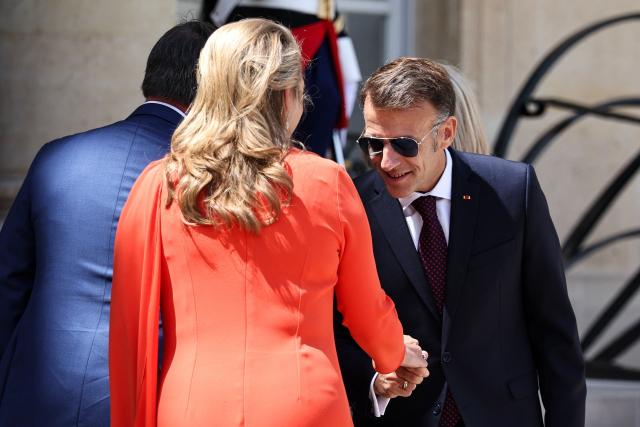 France's President Emmanuel Macron bids farewell Luxembourg's Grand Duchess Stephanie after a meeting at the Elysee Presidential Palace in Paris on July 1, 2026. (Photo by SIMON WOHLFAHRT / AFP)