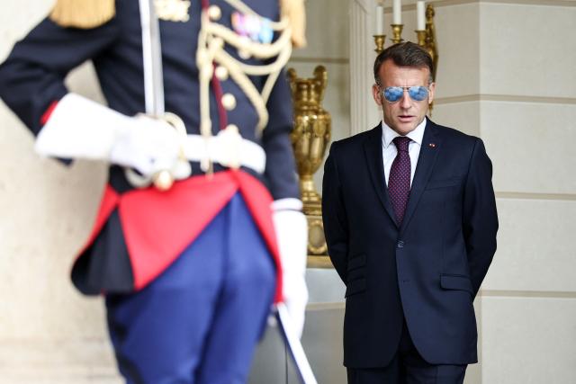 France's President Emmanuel Macron waits to welcome Luxembourg's Grand Duke Guillaume and Luxembourg's Grand Duchess Stephanie at the Elysee Presidential Palace in Paris on July 1, 2026. (Photo by SIMON WOHLFAHRT / AFP)