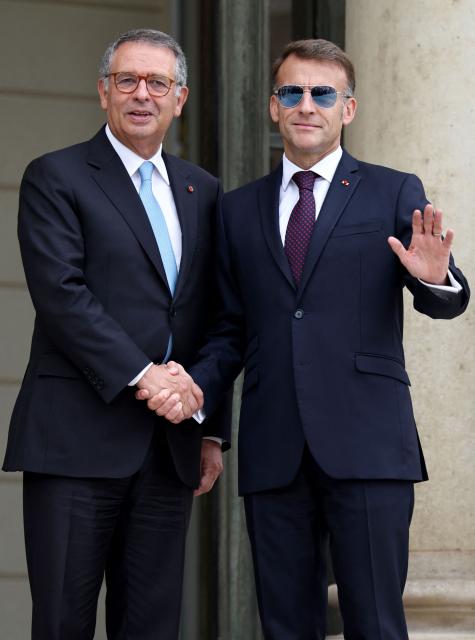 France's President Emmanuel Macron welcomes Portugal's President Antonio Jose Seguro upon his arrival at the Elysee Presidential Palace in Paris on July 1, 2026 ahead of their bilateral meeting. (Photo by SIMON WOHLFAHRT / AFP)