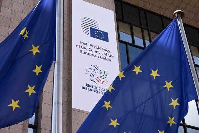 This photograph shows the new poster announcing the start of the Irish presidency of the EU for the next six months on the facade of the European Council in Brussels, on July 1, 2026. (Photo by Nicolas TUCAT / AFP)