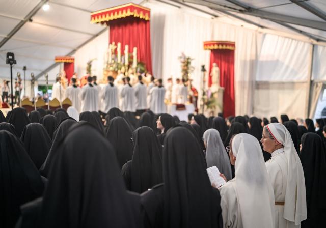 Nuns attend the schismatic consecration of bishops by the traditionalist Catholic Society of Saint Pius X (SSPX) in Econe, western Switzerland, on July 1, 2026. The Society of Saint Pius X consecrated four new bishops on July 1, 2026, in defiance of Pope Leo XIV, who pleaded with the ultra-traditionalist breakaway group to turn back from what he called a "schismatic act" with Rome. (Photo by Fabrice COFFRINI / AFP)