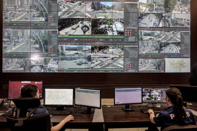 Turkish police officers watch live CCTV images of the streets of Ankara from a monitoring centre as part of NATO security preparations, in Ankara on July 1, 2026. (Photo by Adem ALTAN / AFP)