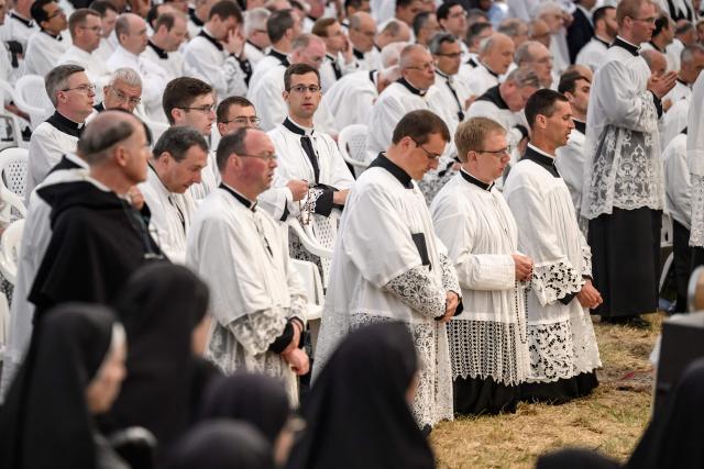Priests attend the schismatic consecration of bishops by the traditionalist Catholic Society of Saint Pius X (SSPX) in Econe, western Switzerland, on July 1, 2026. The Society of Saint Pius X consecrated four new bishops on July 1, 2026, in defiance of Pope Leo XIV, who pleaded with the ultra-traditionalist breakaway group to turn back from what he called a "schismatic act" with Rome. (Photo by Fabrice COFFRINI / AFP)