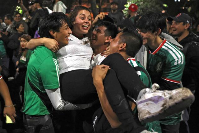 Mexican football fans celebrate Mexico’s victory over Ecuador after the FIFA World Cup 2026 match at the Angel of Independence monument in Mexico City on June 30, 2026. At least three people died during the mass celebrations in Mexico City to mark the national football team’s progress in the 2026 World Cup, the local government reported. (Photo by Claudia Rosel / AFP)