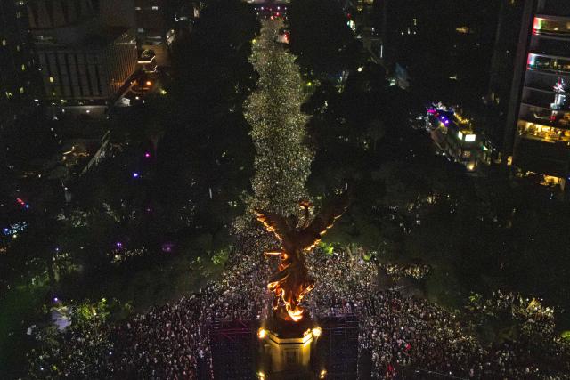 Aerial view of Mexican football fans celebrating Mexico’s victory over Ecuador after the FIFA World Cup 2026 match at the Angel of Independence monument in Mexico City on June 30, 2026. At least three people died during the mass celebrations in Mexico City to mark the national football team’s progress in the 2026 World Cup, the local government reported. (Photo by Claudia Rosel / AFP)