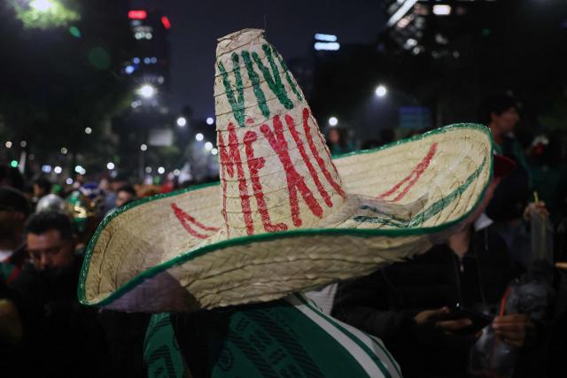 Mexican football fans celebrate Mexico’s victory over Ecuador after the FIFA World Cup 2026 match at the Angel of Independence monument in Mexico City on June 30, 2026. At least three people died during the mass celebrations in Mexico City to mark the national football team’s progress in the 2026 World Cup, the local government reported. (Photo by Claudia Rosel / AFP)