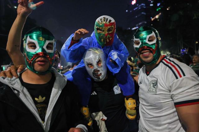 Mexican football fans celebrate Mexico’s victory over Ecuador after the FIFA World Cup 2026 match at the Angel of Independence monument in Mexico City on June 30, 2026. At least three people died during the mass celebrations in Mexico City to mark the national football team’s progress in the 2026 World Cup, the local government reported. (Photo by Claudia Rosel / AFP)