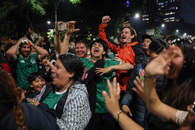 Mexican football fans celebrate Mexico’s victory over Ecuador after the FIFA World Cup 2026 match at the Angel of Independence monument in Mexico City on June 30, 2026. At least three people died during the mass celebrations in Mexico City to mark the national football team’s progress in the 2026 World Cup, the local government reported. (Photo by Claudia Rosel / AFP)