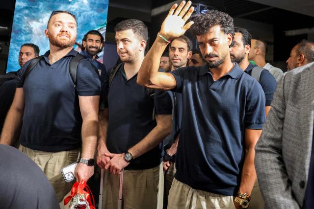 Members of Iran's men's national football team look onduring their reception at Tehran's Mehrabad International Airport on July 1, 2026 upon their return from the 2026 FIFA World Cup. (Photo by AFP)