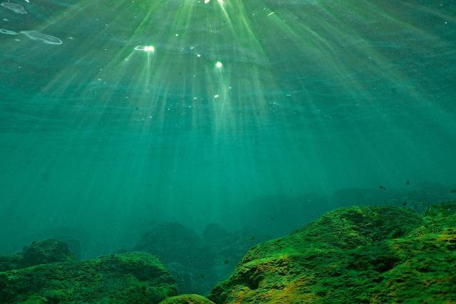 (FILES) (FILES) This underwater photograph shows light penetrating the water surface in the Mediterranean Sea off the coast of Batroun city on August 1, 2023. According to the European Union's Copernicus Marine Service, the world's oceans just experienced their hottest June on record, global average sea surface temperatures in June were 20.98C, beating the previous records of 2023 and 2024, and could set fresh highs in the months ahead as El Nino and climate change drive temperatures even higher, scientists said on July 01, 2026. (Photo by Ibrahim CHALHOUB / AFP)