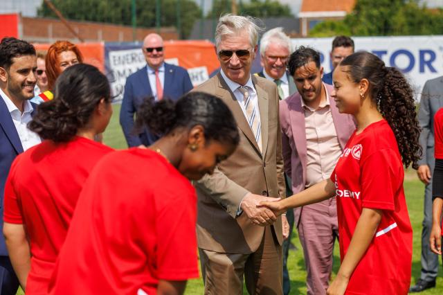 King Philippe - Filip of Belgium (C) meets with young people during his visit to the Red Side Academy at the KV Kortrijk training centre, in Kortrijk on July 1, 2026. (Photo by KURT DESPLENTER / Belga / AFP) / Belgium OUT