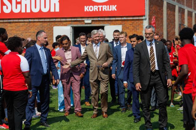 King Philippe - Filip of Belgium (C) arrives to visit the Red Side Academy at the KV Kortrijk training centre, in Kortrijk on July 1, 2026. (Photo by KURT DESPLENTER / Belga / AFP) / Belgium OUT