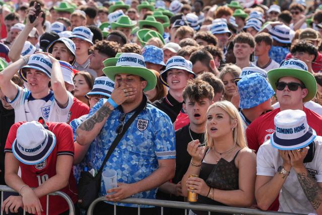 England supporters react after DR Congo's first goal as they watch the 2026 World Cup round-of-32 football match between England and the Democratic Republic of Congo, at the 4TheFans Fan Park in Brighton, southern England on July 1, 2026. (Photo by CARLOS JASSO / AFP)