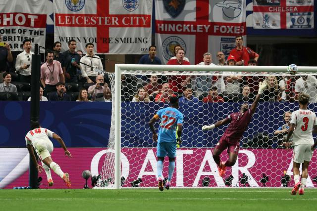 Congo DR's goalkeeper #01 Lionel Mpasi makes a save past England's midfielder #10 Jude Bellingham during the 2026 World Cup round of 32 match football between England and the Democratic Republic of Congo at the Atlanta Stadium in Atlanta on July 1, 2026.  (Photo by Odd ANDERSEN / AFP)