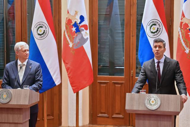 Chile's President Jose Antonio Kast (L) listens as Paraguay's President Santiago Pena (R) speaks during a joint press conference in Asuncion on July 1, 2026. (Photo by DANIEL DUARTE / AFP)