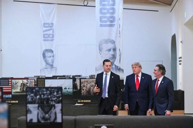 US President Donald Trump walks with Secretary of the Interior Doug Burgum (R) and Robbie Lauf (L), Executive Director of the Theodore Roosevelt Presidential Library, as he tours the Theodore Roosevelt Presidential Library in Medora, North Dakota, on July 1, 2026. . (Photo by SAUL LOEB / AFP)