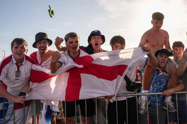 England supporters celebrate the team's victory after watching the 2026 World Cup round-of-32 football match between England and the Democratic Republic of Congo, at the 4TheFans Fan Park in Brighton, southern England on July 1, 2026. (Photo by CARLOS JASSO / AFP)