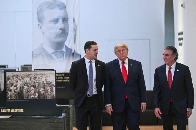 US President Donald Trump walks with Secretary of the Interior Doug Burgum (R) and Robbie Lauf (L), Executive Director of the Theodore Roosevelt Presidential Library, as he tours the Theodore Roosevelt Presidential Library in Medora, North Dakota, on July 1, 2026. . (Photo by SAUL LOEB / AFP)